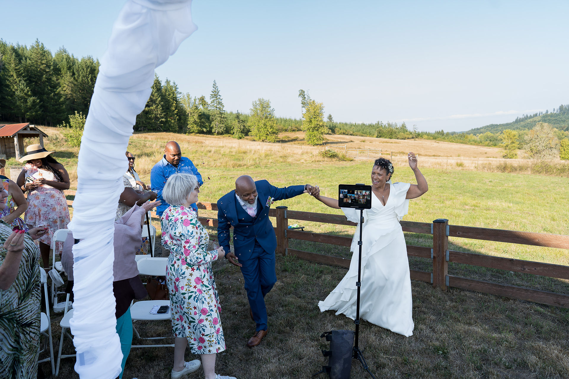 Happy bride and groom dancing at their intimate outdoor farm wedding.