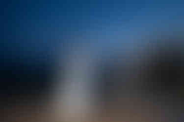 Wedding couple dancing at their intimate farm wedding reception at dusk.