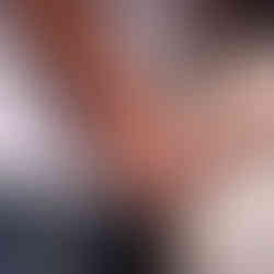 Couple holding hands, engagement ring visible