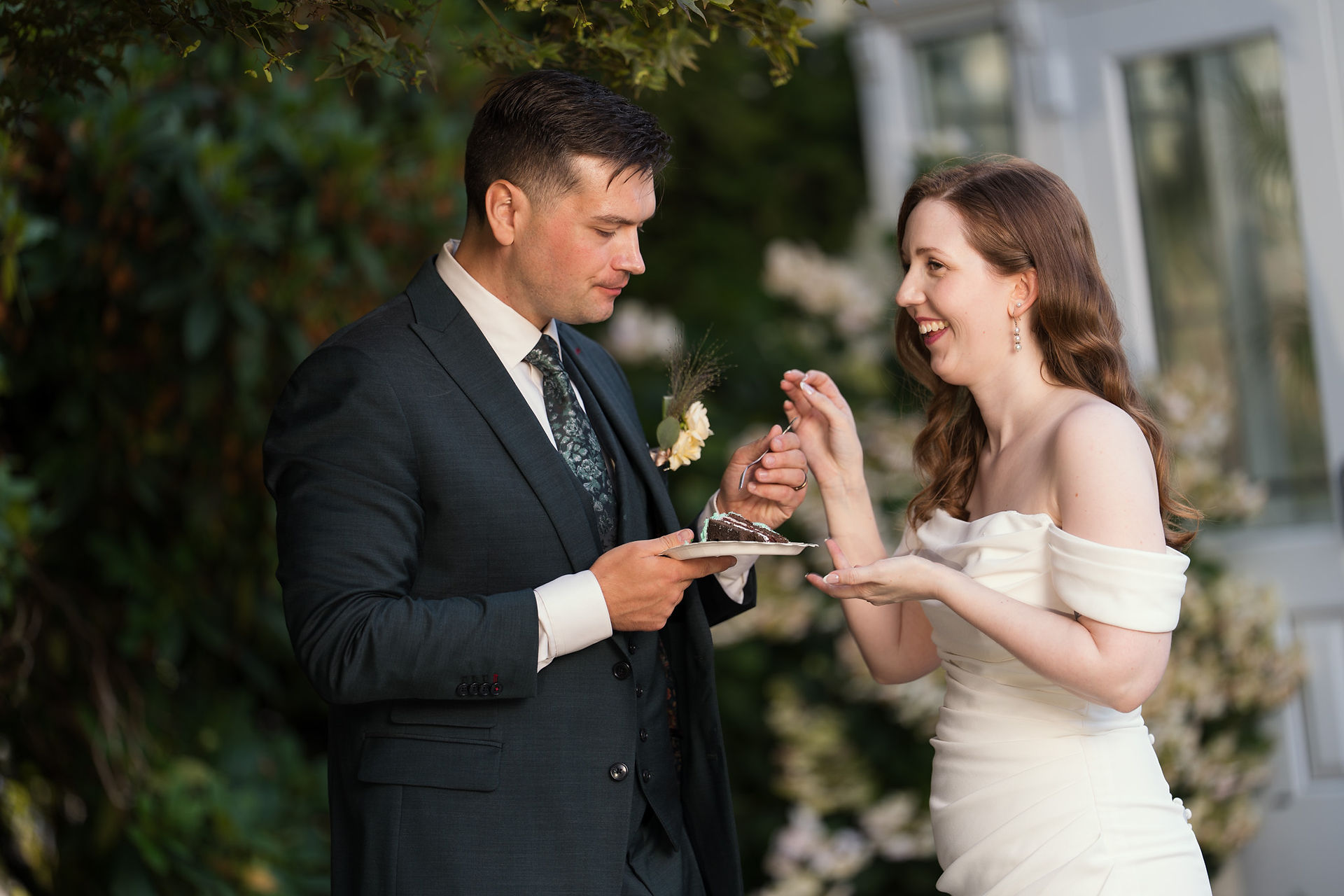 Couple sharing cake at Volunteer Park Conservatory in Seattle.