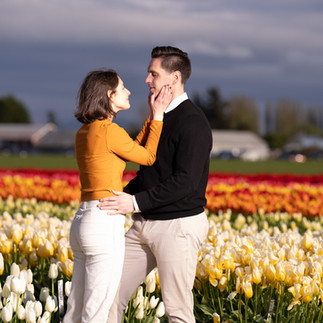 Engaged couple embracing at Skagit Tulip Festival
