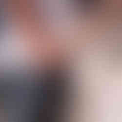 Couple holding hands, showcasing engagement ring