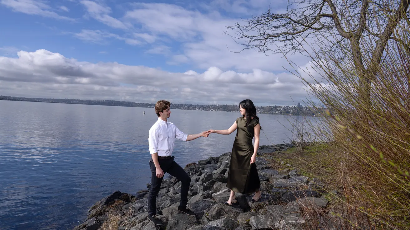 Couple holding hands by Seattle waterfront