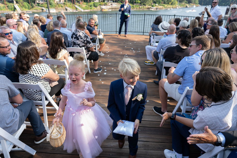 Flower girl, ring bearer walk aisle at outdoor Wedding at The Foundry.