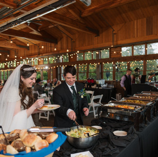 Bride and groom at Gold Mountain Golf Club wedding buffet