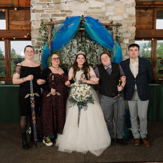 Bride and wedding party with swords at Gold Mountain