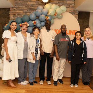 Group photo of healthcare workers at a ceremony