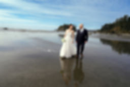 Couple eloping on a reflective PNW beach