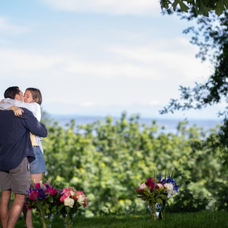 Couple embracing after proposal at Green Lake