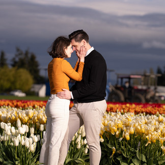 Engaged couple embracing in a tulip field at Skagit Tulip Festival