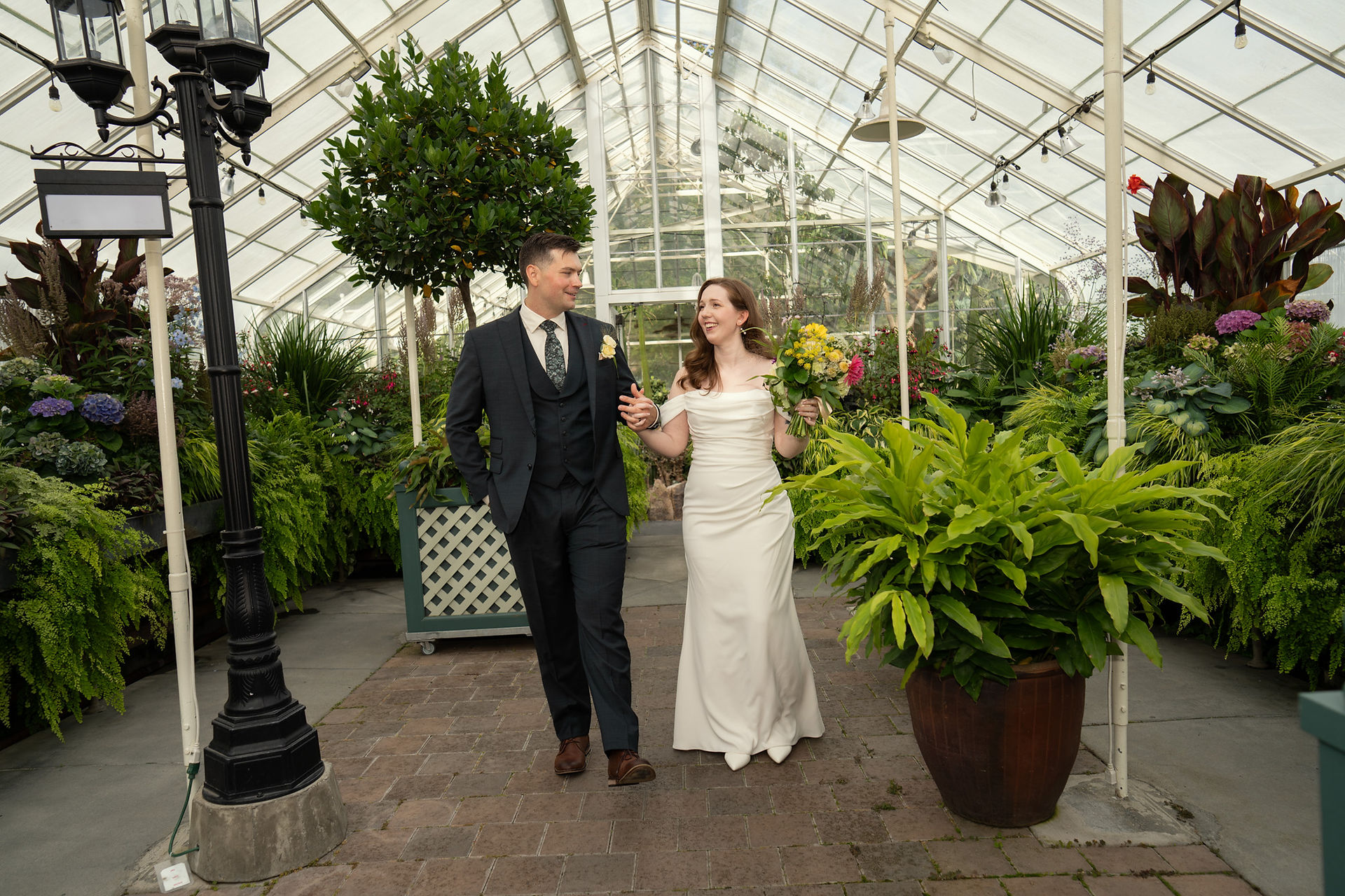 Couple walking at Volunteer Park Conservatory in Seattle