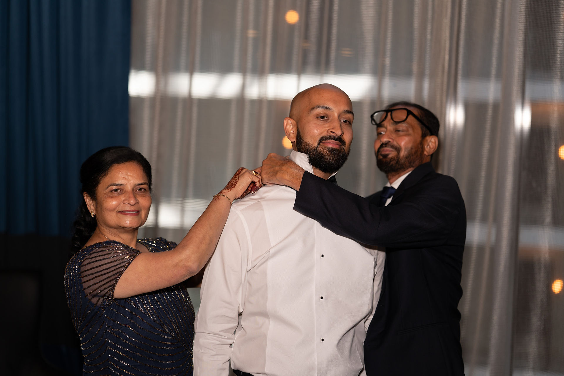 Groom getting ready with family by a WA wedding photographer
