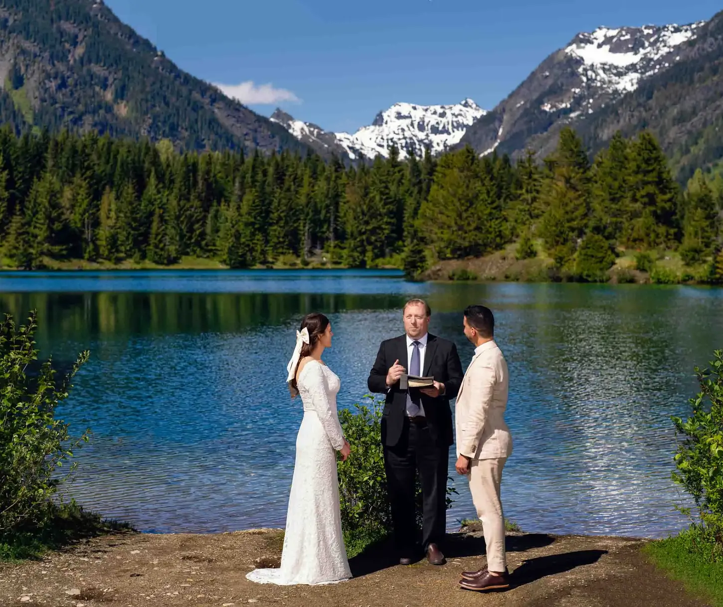 Bride, groom, officiant at mountain lake wedding, PNW wedding photographer.