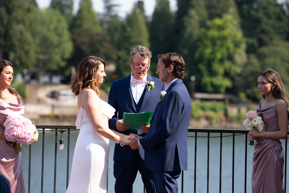 Bride, groom, officiant at outdoor summer wedding at The Foundry Lake Oswego.