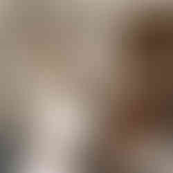 Bride in white gown holding bouquet, man in hat, 