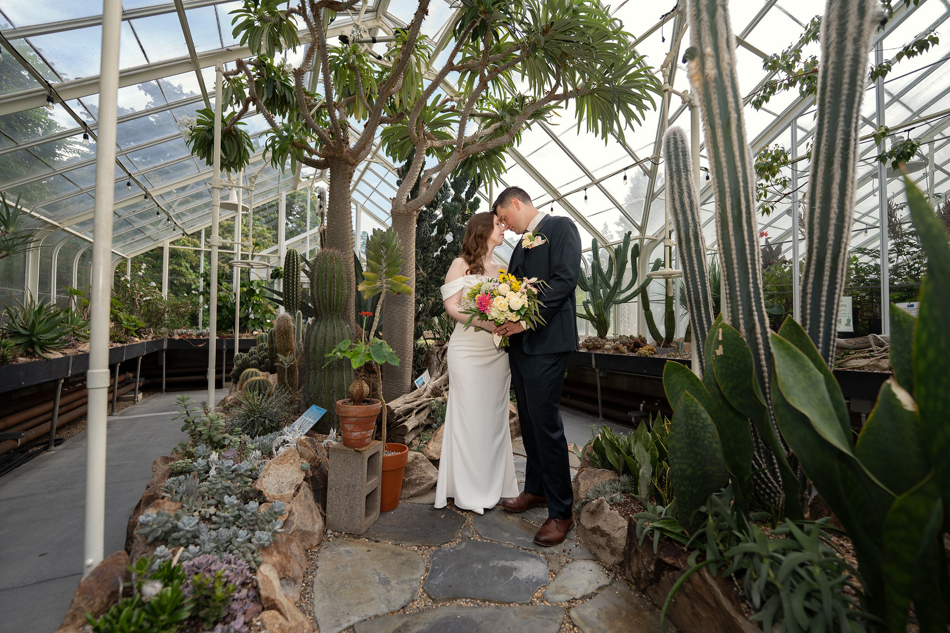 Wedding couple at Volunteer Park Conservatory in Seattle.