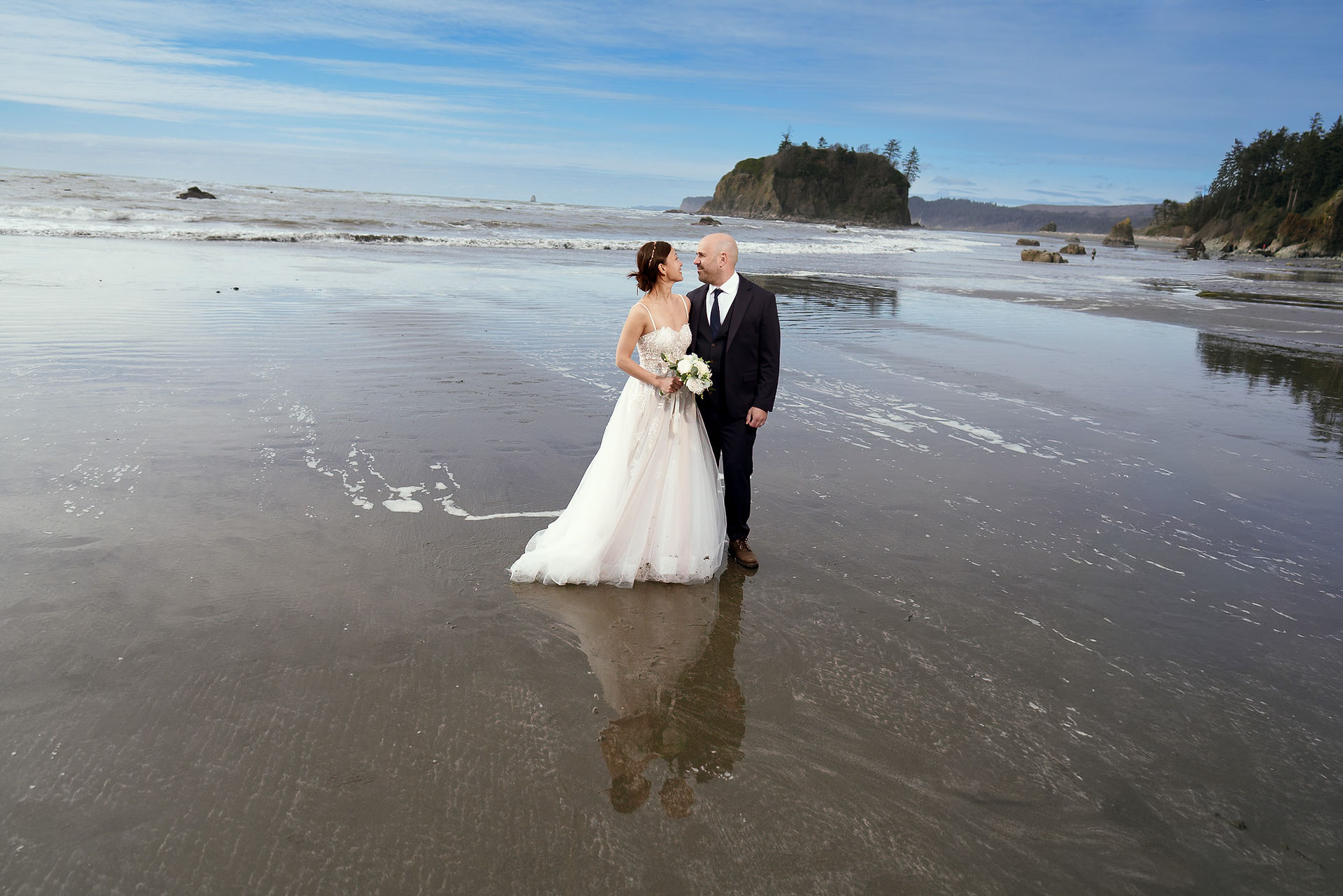 Bride and groom eloping on Olympic National Park beach