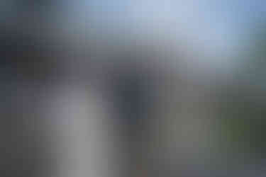 Bride and man talking at an intimate outdoor farm wedding.