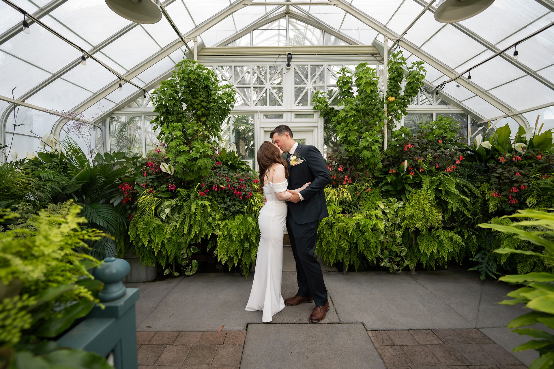 Couple kissing at Volunteer Park Conservatory in Seattle.