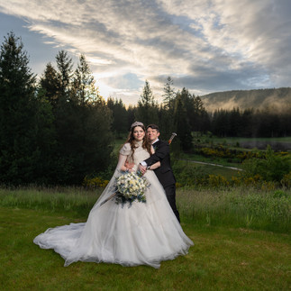 Wedding couple embracing outdoors at Gold Mountain Golf Club