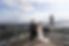 Couple exchanging vows on a Seattle rooftop wedding, Smith Tower background.