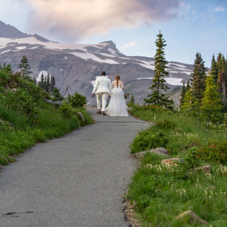 Couple walking away on mountain path