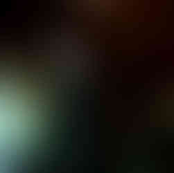 Elegant man dances with smiling older woman at a wedding reception.