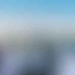 Couple shares first kiss at Intimate Farm Wedding ceremony. Guests watch.