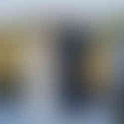 Bride and groom exchanging rings at an intimate outdoor farm wedding.