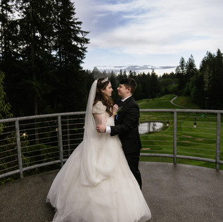 Bride and groom embracing at Gold Mountain Golf Club Weddings