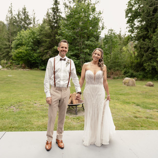 Bride and groom holding hands at Forest Creek Darrington WA