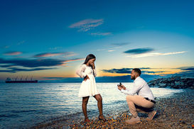 Romantic beach proposal at sunset