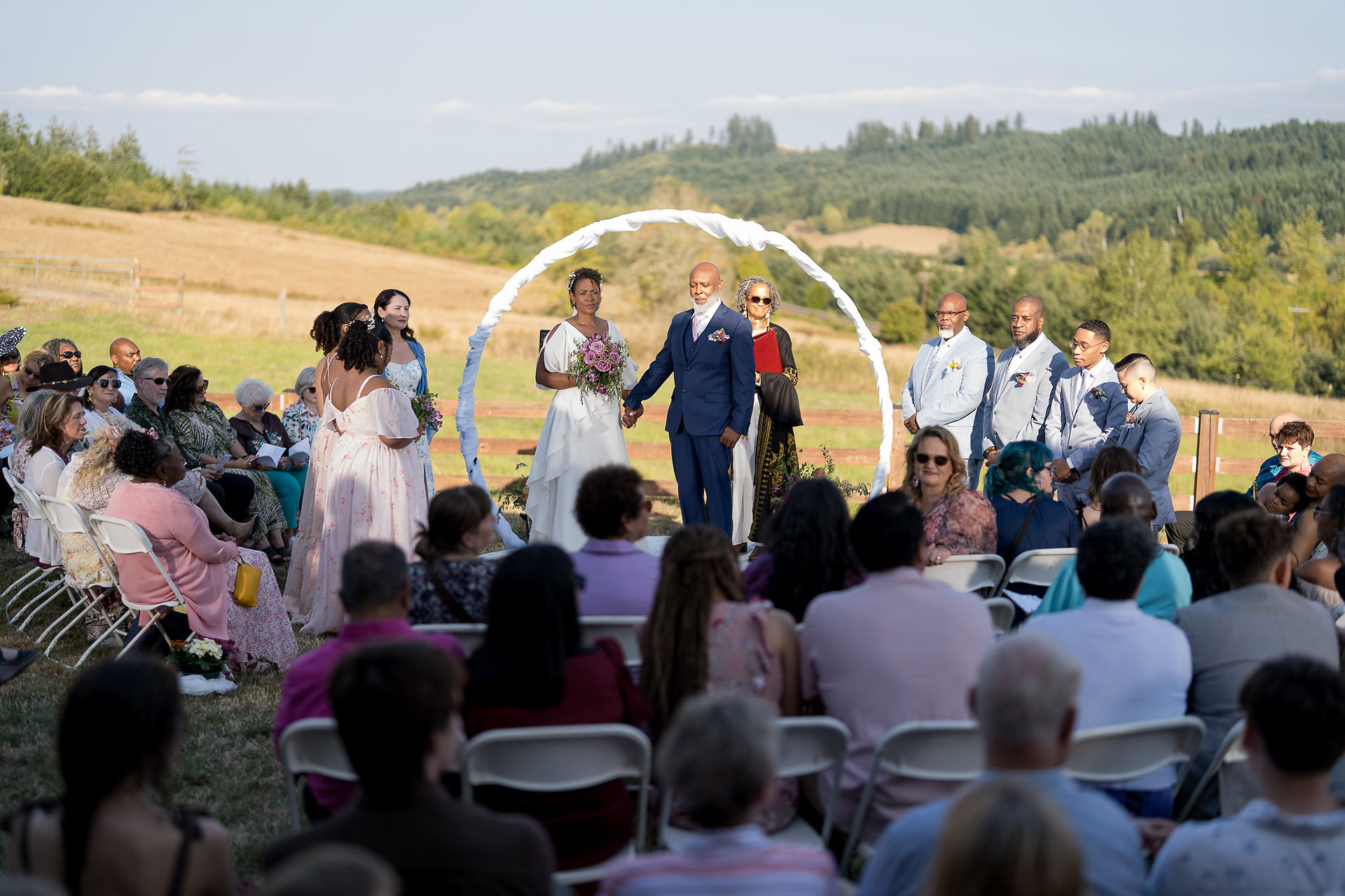 Couple getting married at their intimate outdoor farm wedding ceremony.
