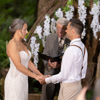 Bride and groom exchange vows at Forest Creek Darrington WA.