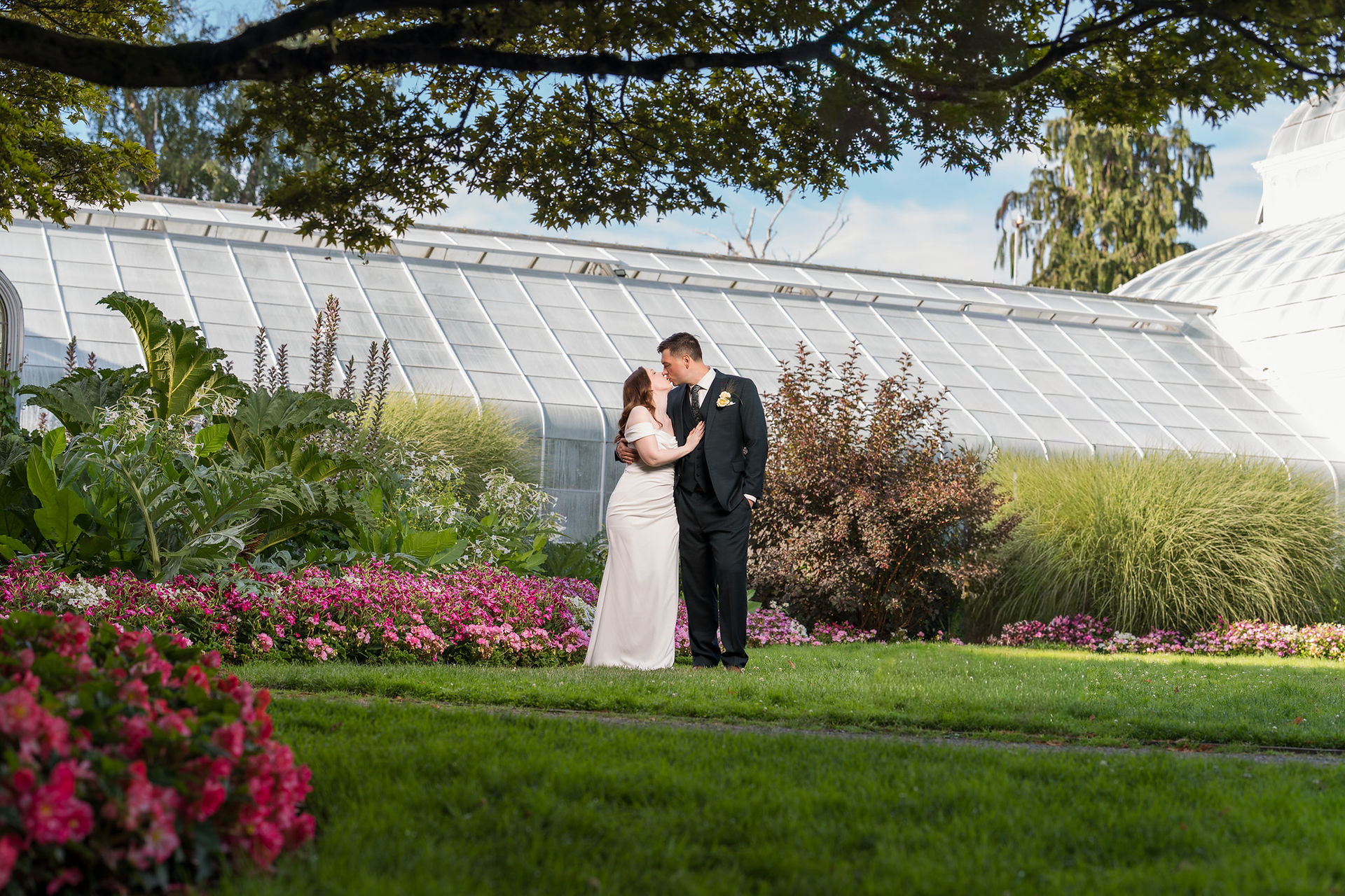 Couple kissing at Volunteer Park Conservatory in Seattle.