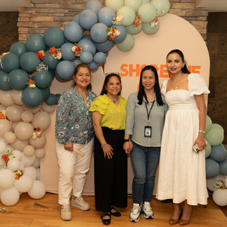 Four women pose at Shoreline event