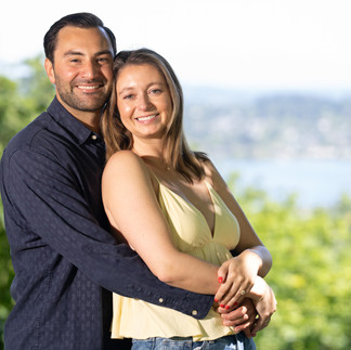 Happy couple embraces, Green Lake proposal