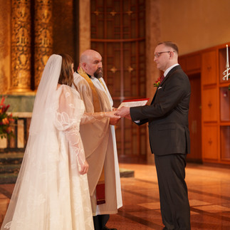 Bride and groom exchanging vows at Bastyr Chapel Wedding, Kenmore WA.