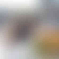 Older woman signing document while couple watches at intimate farm wedding.