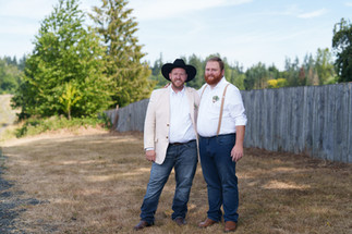 Joyful men, cowboy hat, outdoor wedding at The Barn on Jackson.
