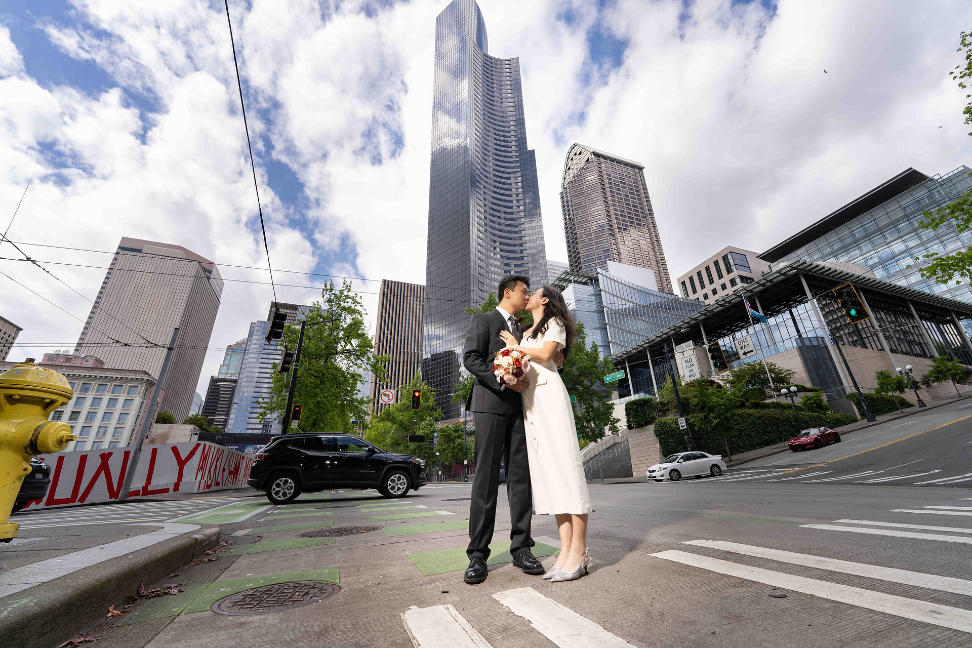Couple kissing in Seattle, city backdrop