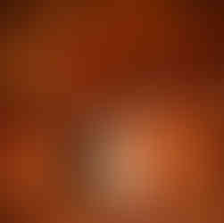 Bride and father walk arm-in-arm down chapel aisle, guests watching.