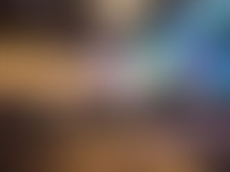 Panel discussion with engaged audience at a Seattle conference—speaker on stage, branding backdrop, and note-taking attendees.