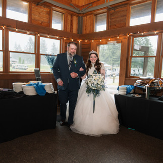 Bride and father walk at Gold Mountain Golf Club wedding