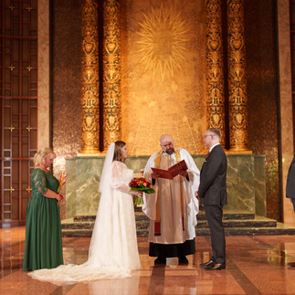 Bride, groom, and officiant at Bastyr Chapel Wedding in Kenmore WA.