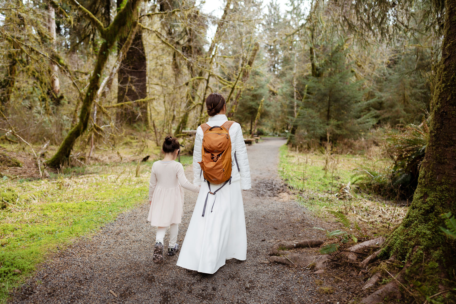 Woman, girl walk Hoh Rain Forest path for Olympic National Park elopement