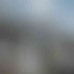 Bride and father walking to outdoor farm wedding ceremony.