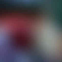 Couple celebrating engagement, Marry Me balloons, roses