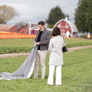 Couple with blanket in a tulip field at Skagit Tulip Festival