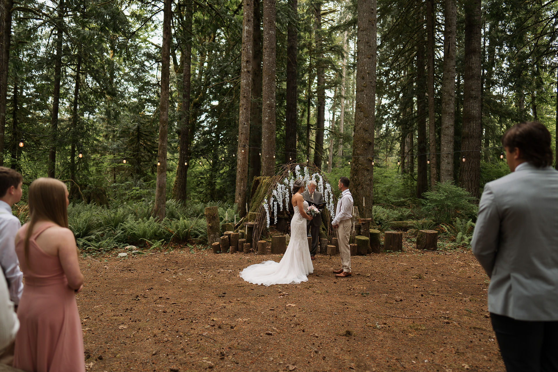 Wedding ceremony at Forest Creek Darrington WA in the woods